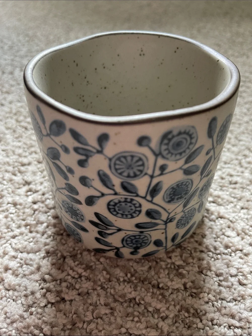 Speckled Ceramic Mug with Blue Floral Pattern